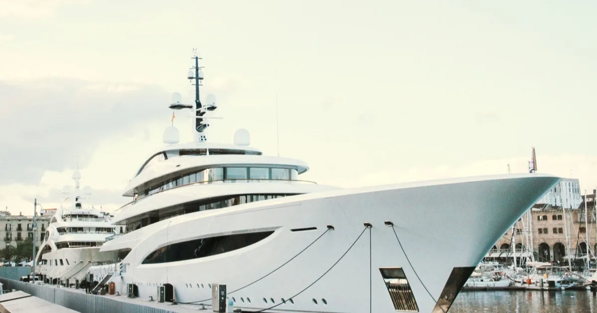 Professional yacht cleaning service at Ataköy Marina in Istanbul with the city skyline in the background